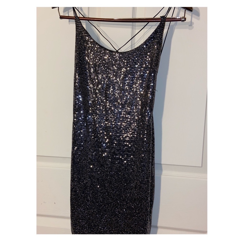 Backless NYE dress. Very comfortable and stretches, great for a night out.